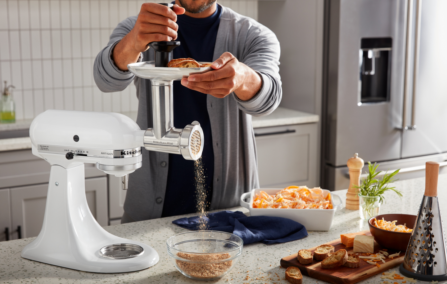 Person using food grinder attachment to make bread crumbs