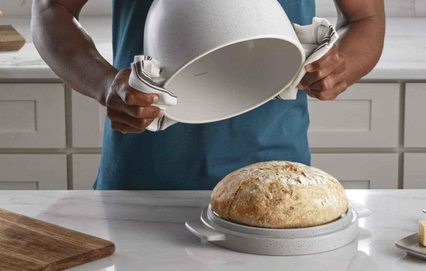 Man using the KitchenAid® Bread Bowl for fresh-baked bread