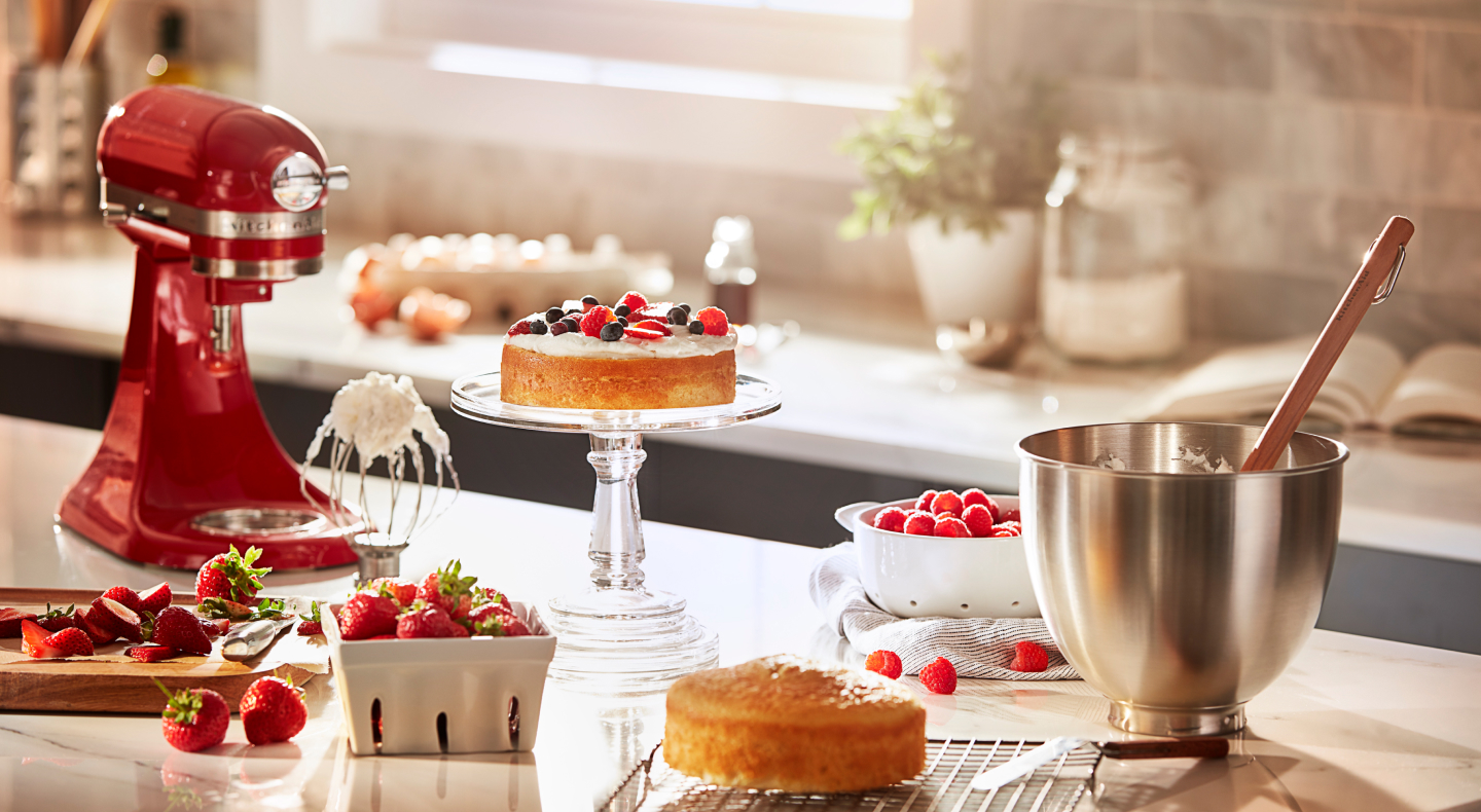 KitchenAid® stand mixer on a countertop with baked goods