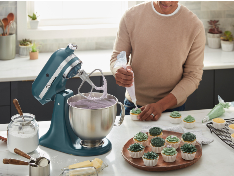 Person using a KitchenAid® stand mixer