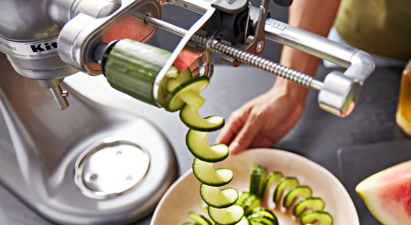 A KitchenAid® spiralizer with a cucumber