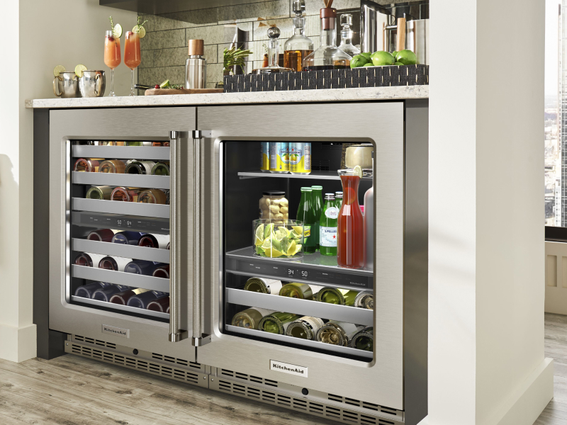 A fridge filled with drinks to pair with a charcuterie board
