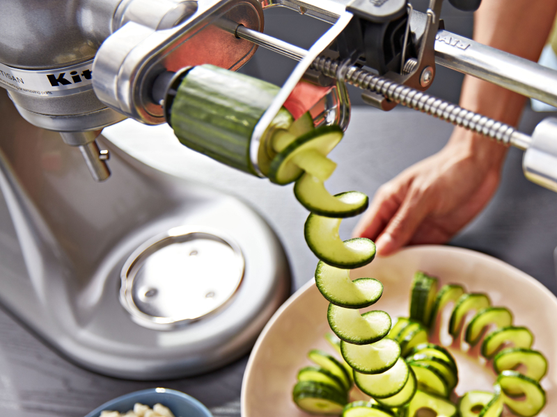 A KitchenAid® spiralizer with a cucumber