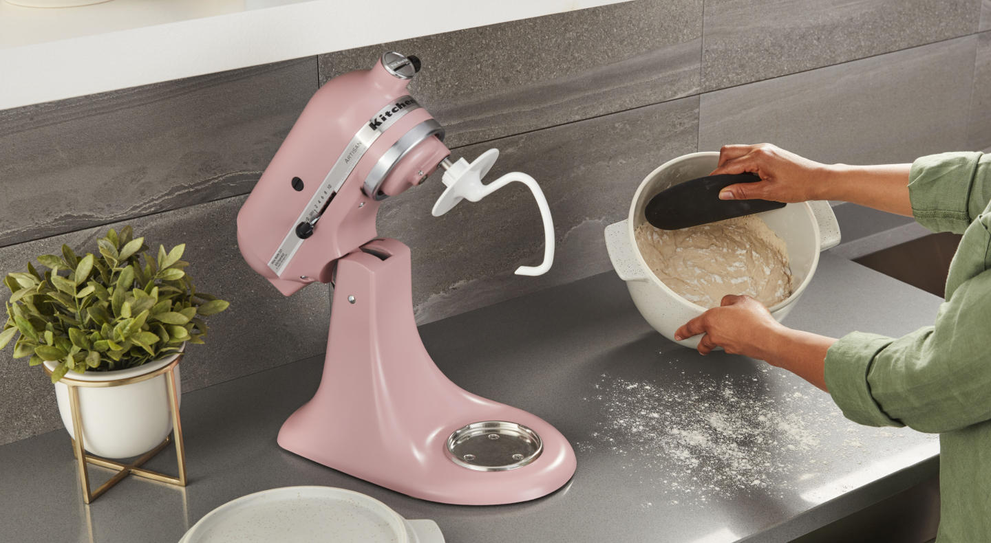 Scraping dough from a mixer bowl