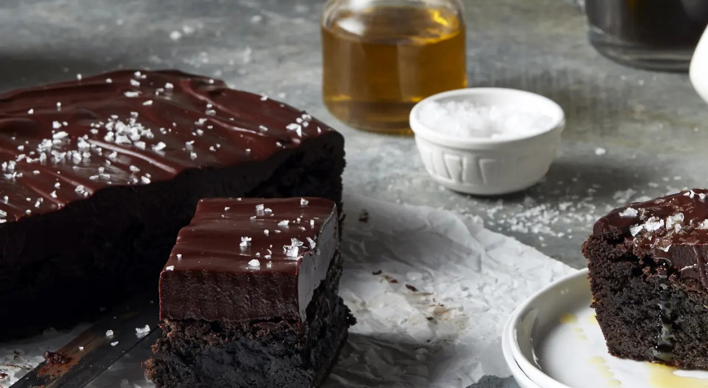 Chocolate frosted brownies topped with flaky sea salt
