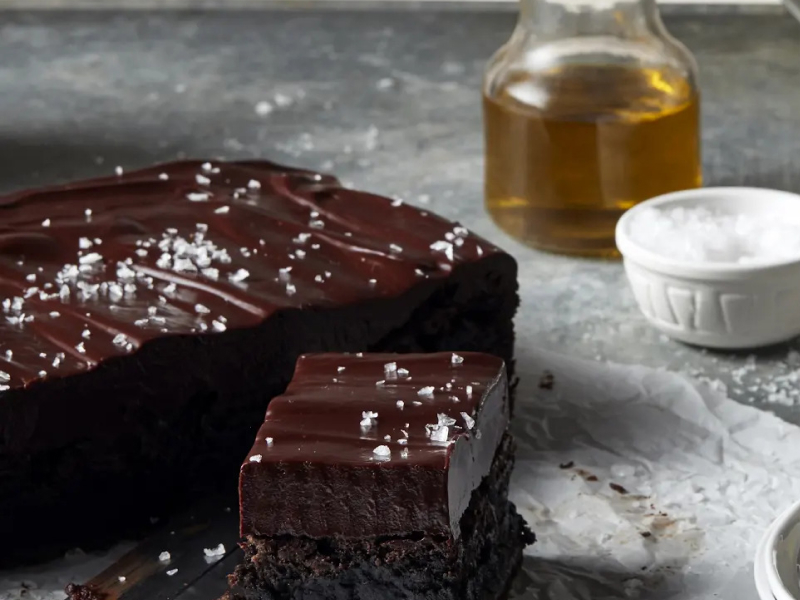 Chocolate frosted brownies topped with flaky sea salt