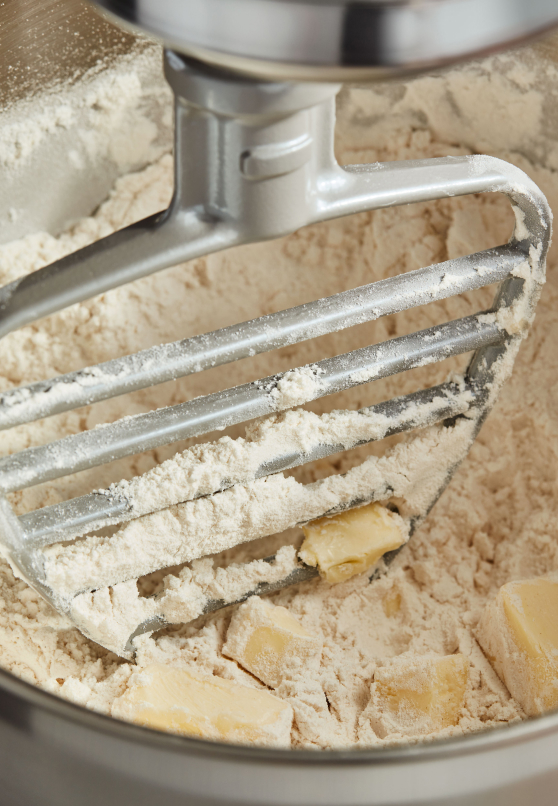 KitchenAid(R) Pastry Beater cutting butter into flour