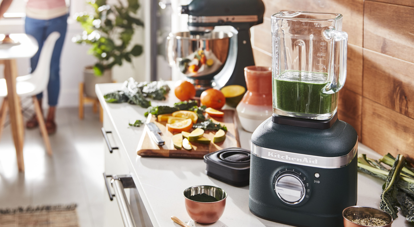 View of kitchen counter with chutney in blender and ingredients