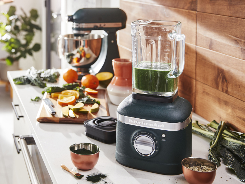 View of kitchen counter with chutney in blender and ingredients