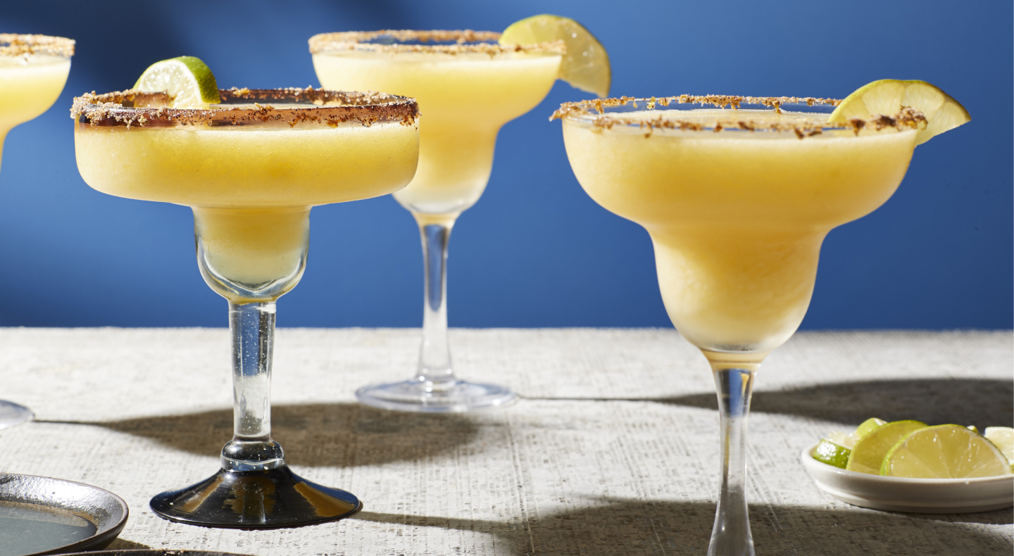 Mango margaritas in margarita glasses