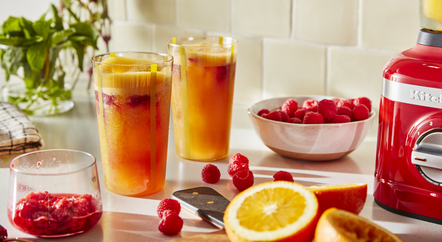 Frozen margaritas on a counter with fruit