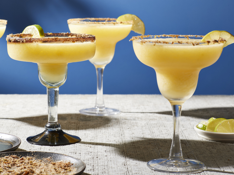 Mango margaritas in margarita glasses