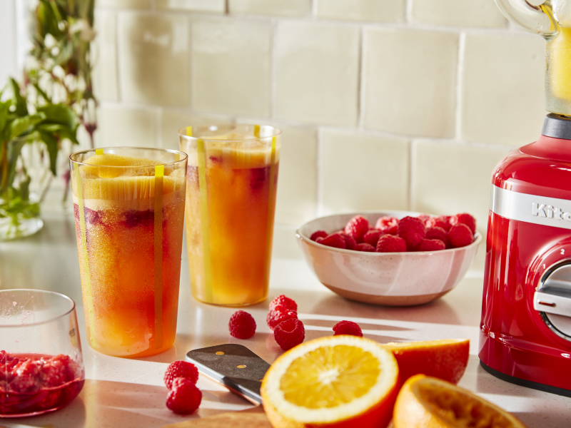Frozen margaritas on a counter with fruit