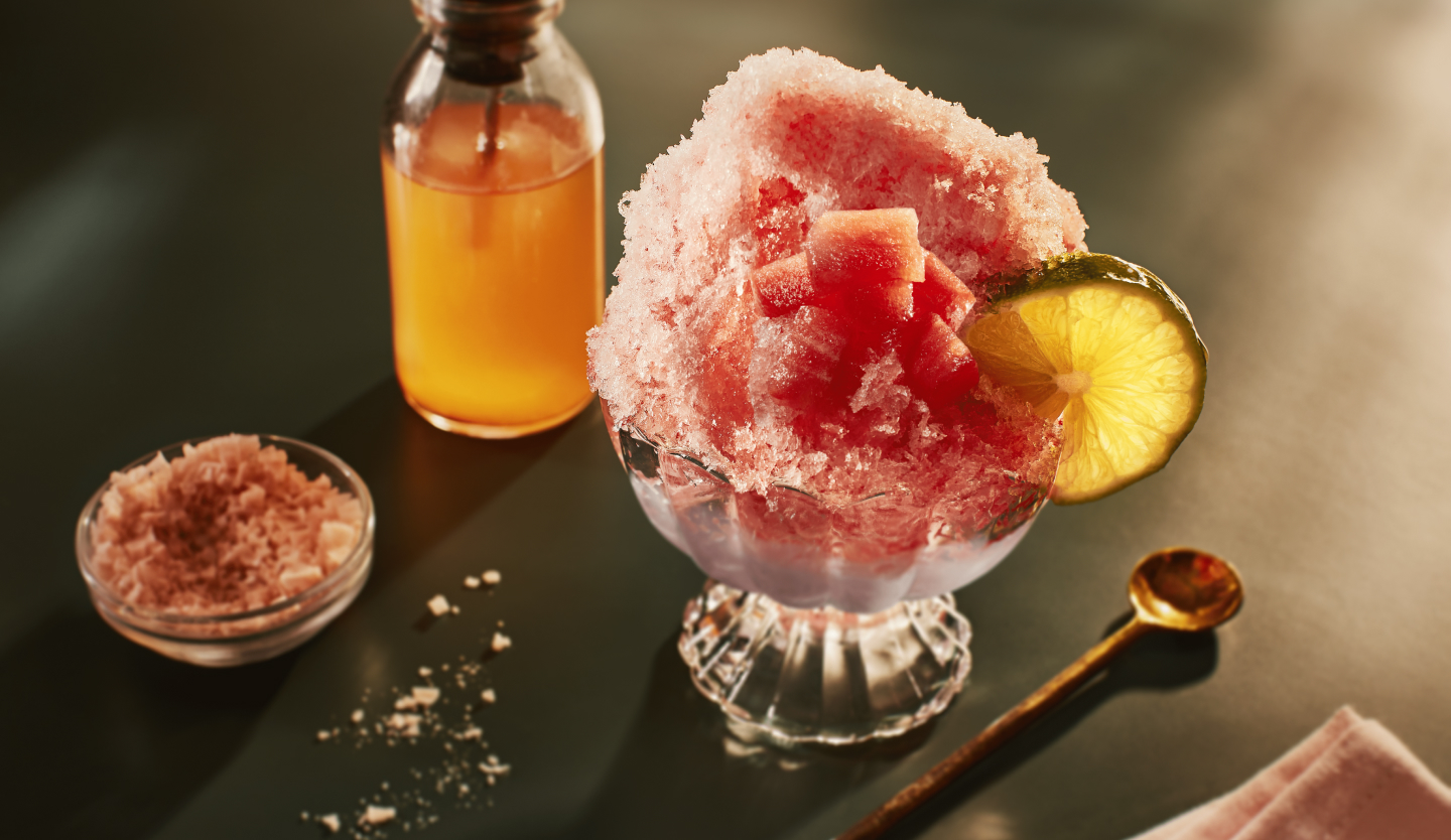 Watermelon Italian ice garnished with a lime 