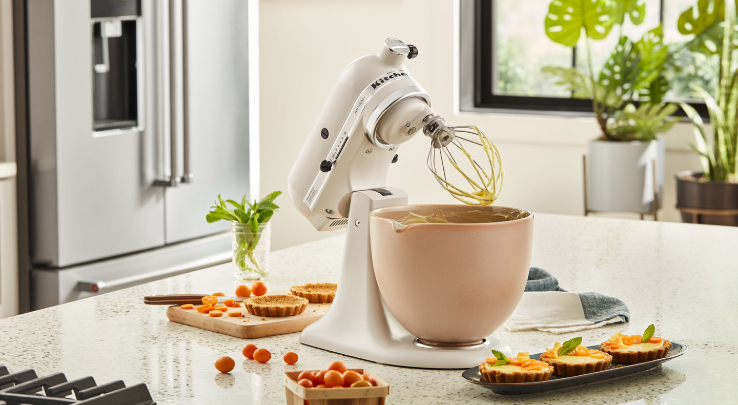  KitchenAid® stand mixer next to mini-quiches on countertop
