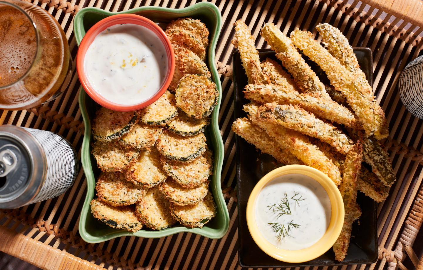 Plates of fried vegetables and dishes of vegan queso.
