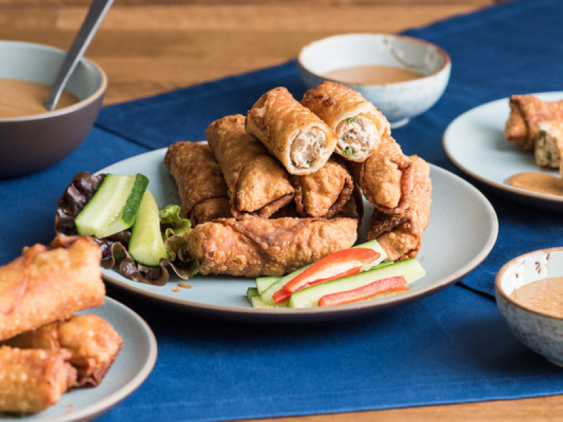 A plate of eggrolls containing minced chicken