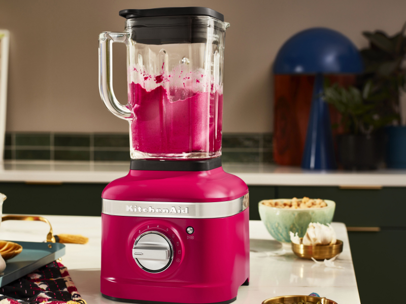 Hibiscus KitchenAid® blender next to various ingredients
