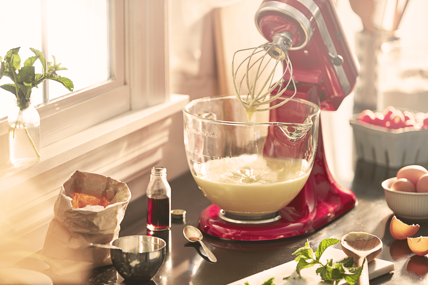 A stand mixer with a bowl of mix