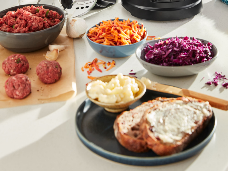 Shredded carrots and cabbage next to buttered toast