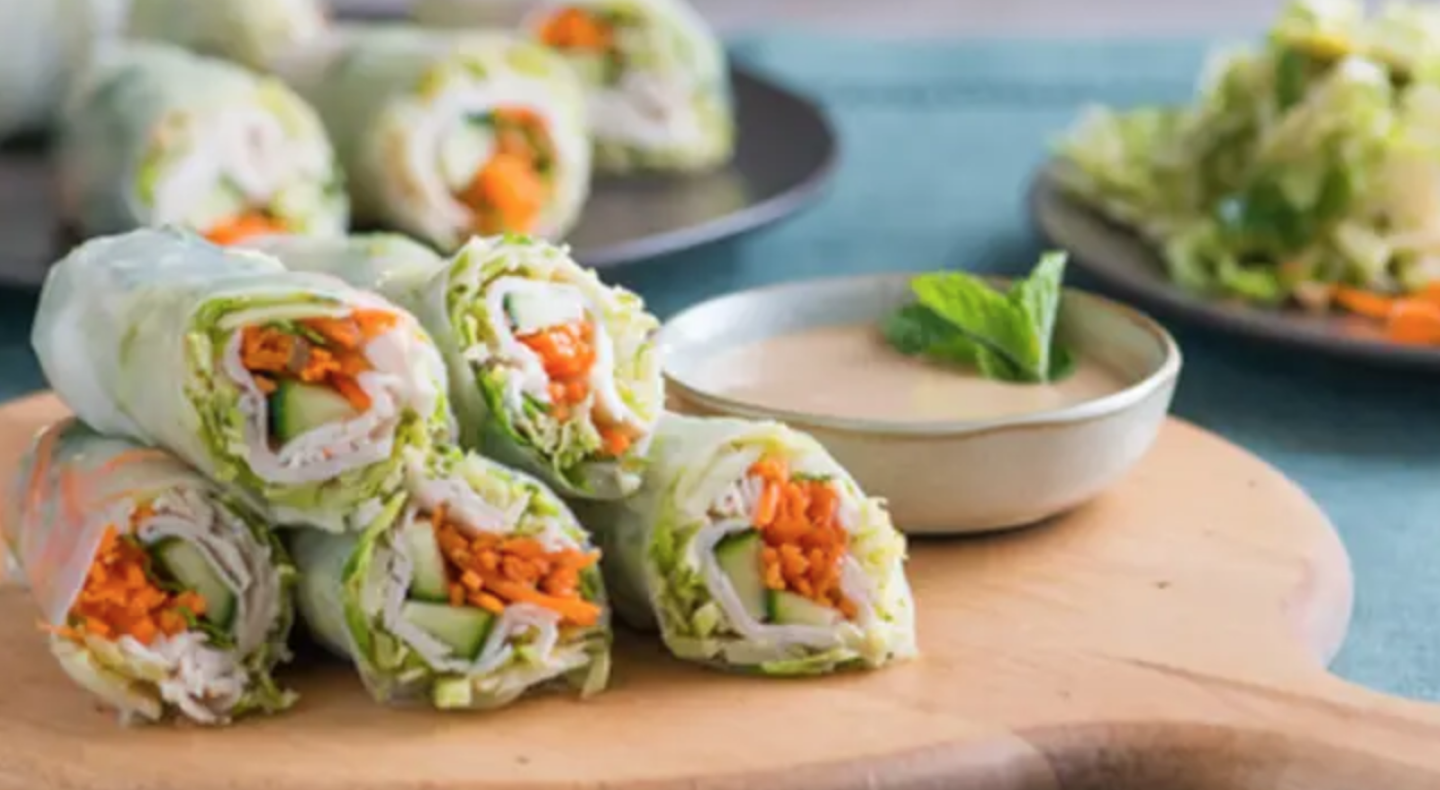 Spring rolls on a wooden cutting board