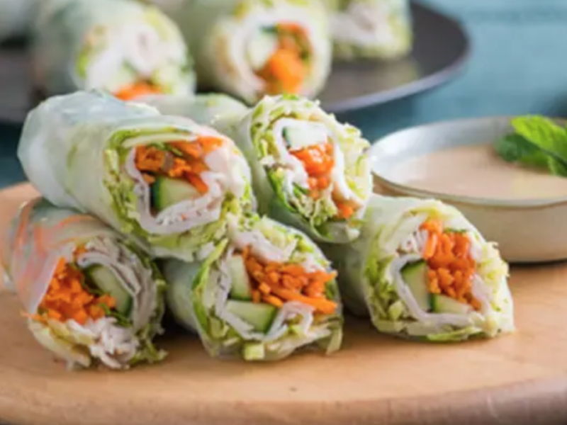 Spring rolls on a wooden cutting board