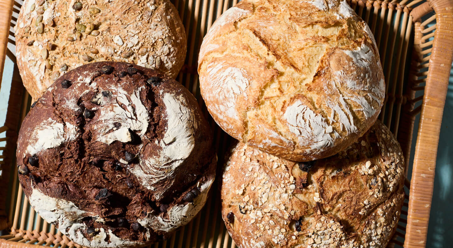 Four loaves of bread in a basket