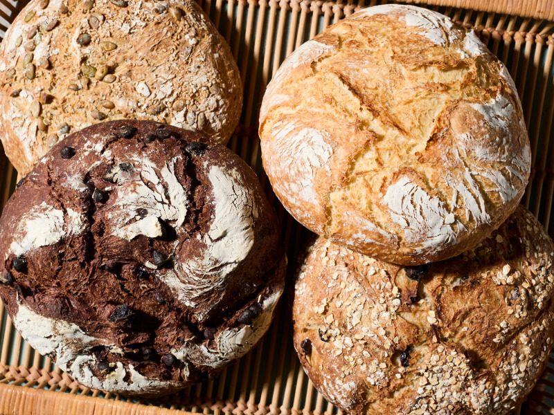 Four loaves of bread in a basket