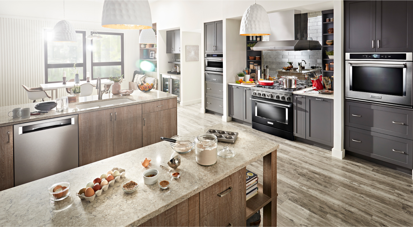 Modern kitchen with ingredients spread out on an island countertop