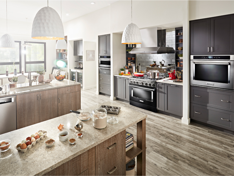 Modern kitchen with ingredients spread out on an island countertop
