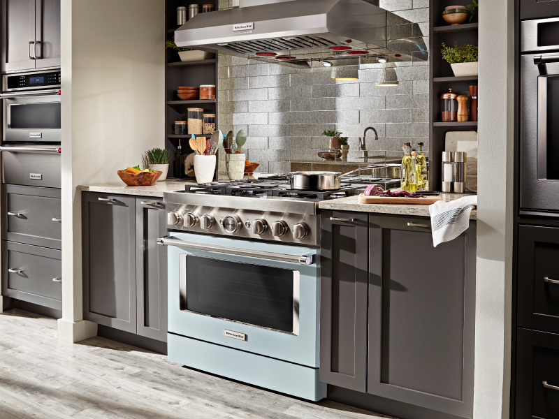 Blue KitchenAid® gas range installed in an updated kitchen