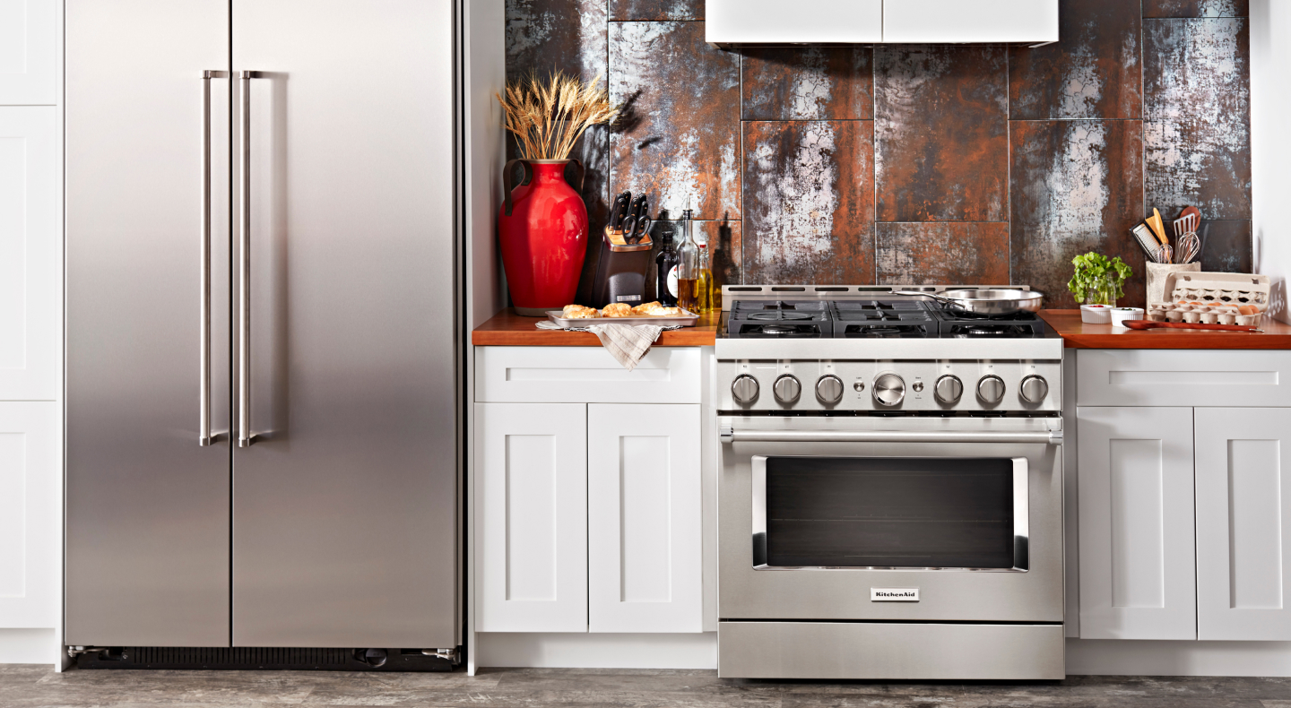 Stainless steel KitchenAid® gas range and side-by-side refrigerator 