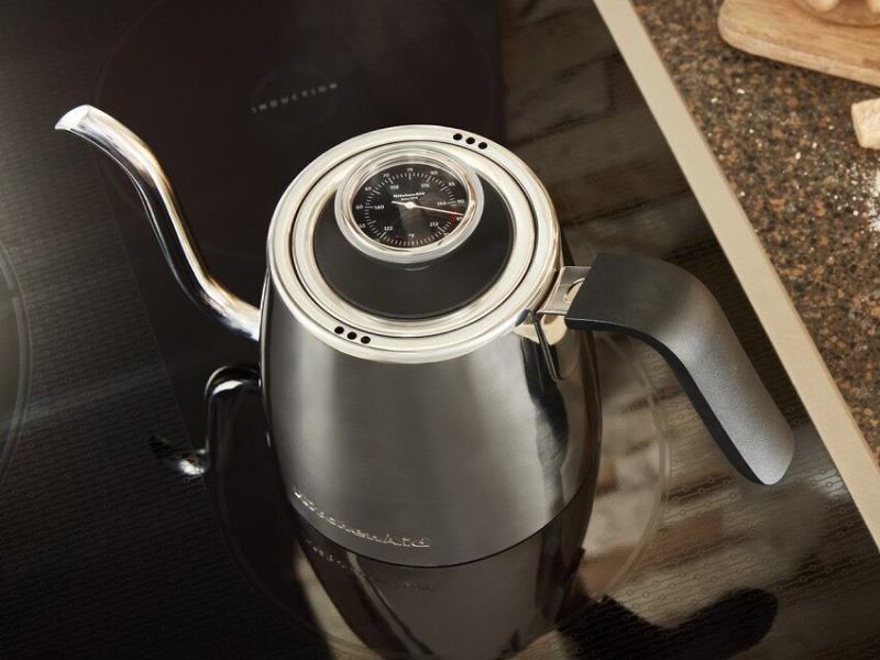 Gooseneck kettle next to pour over coffee maker 