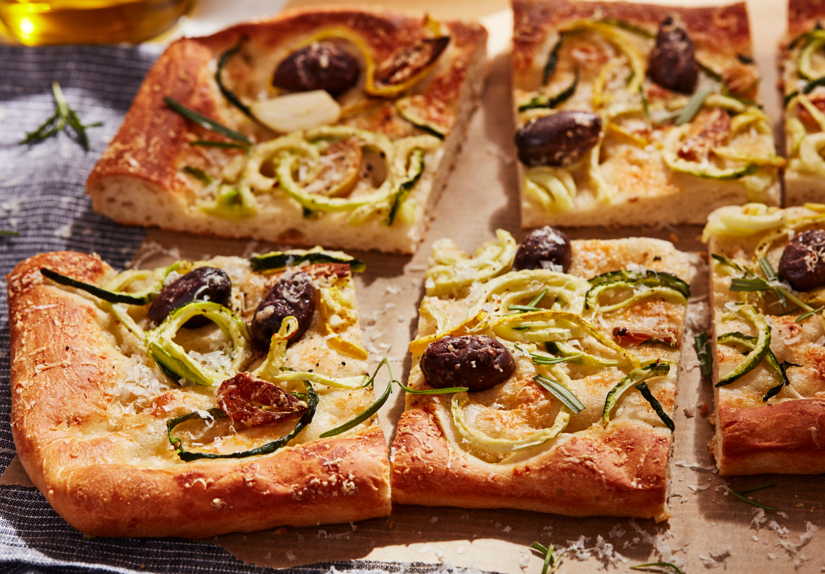 Thin crust, artisan pizza cut into slices