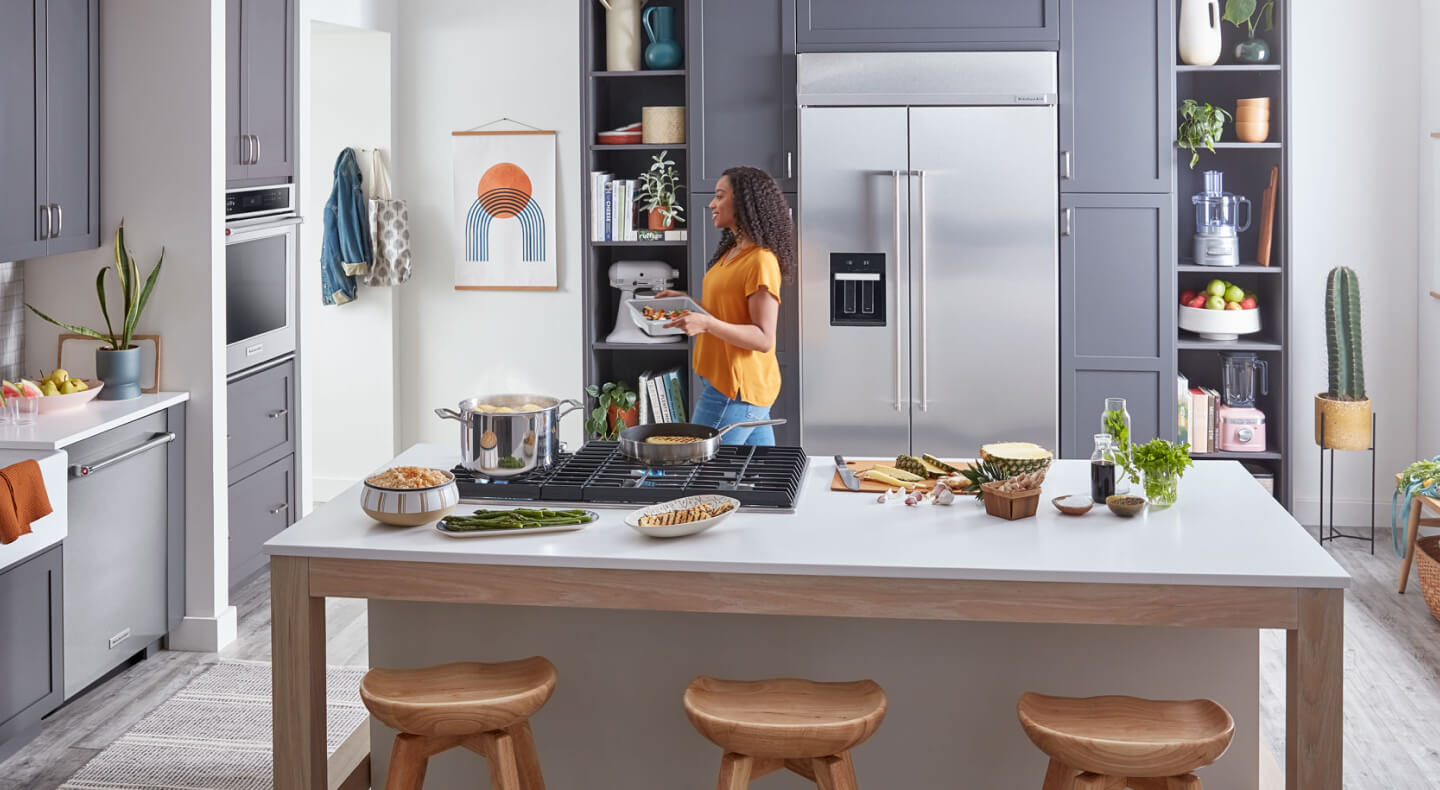 A KitchenAid® large capacity refrigerator tucked into cabinet space