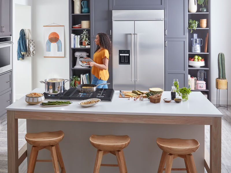 A KitchenAid® large capacity refrigerator tucked into cabinet space