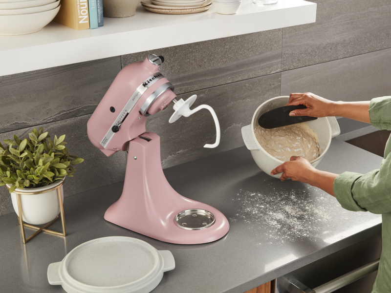 A person proofing dough made with a KitchenAid® stand mixer