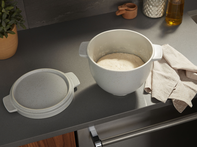Dough waiting to be proofed in a stand mixer bowl