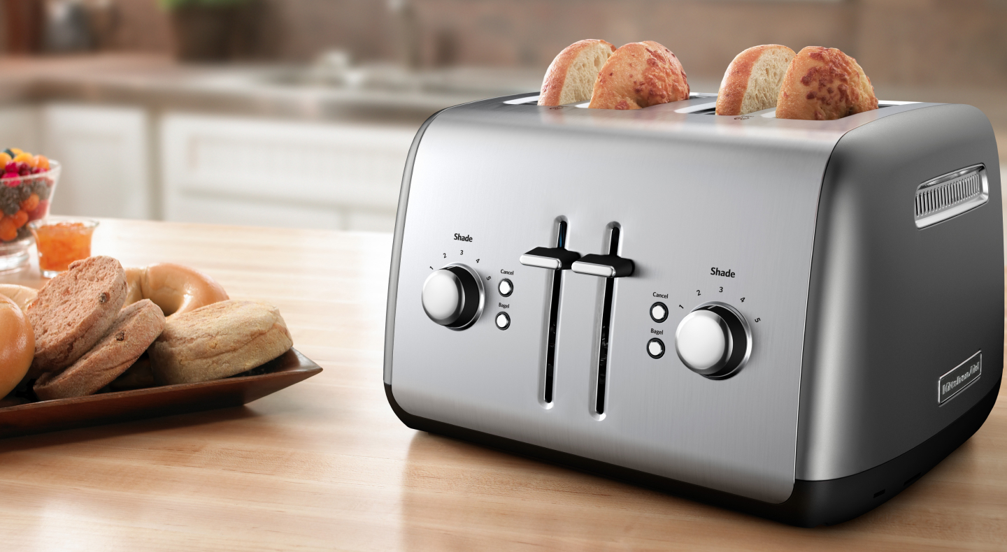 Bagels made with a KitchenAid® 4-slice toaster on butcher block countertop