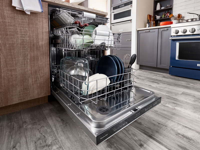 A full open dishwasher
