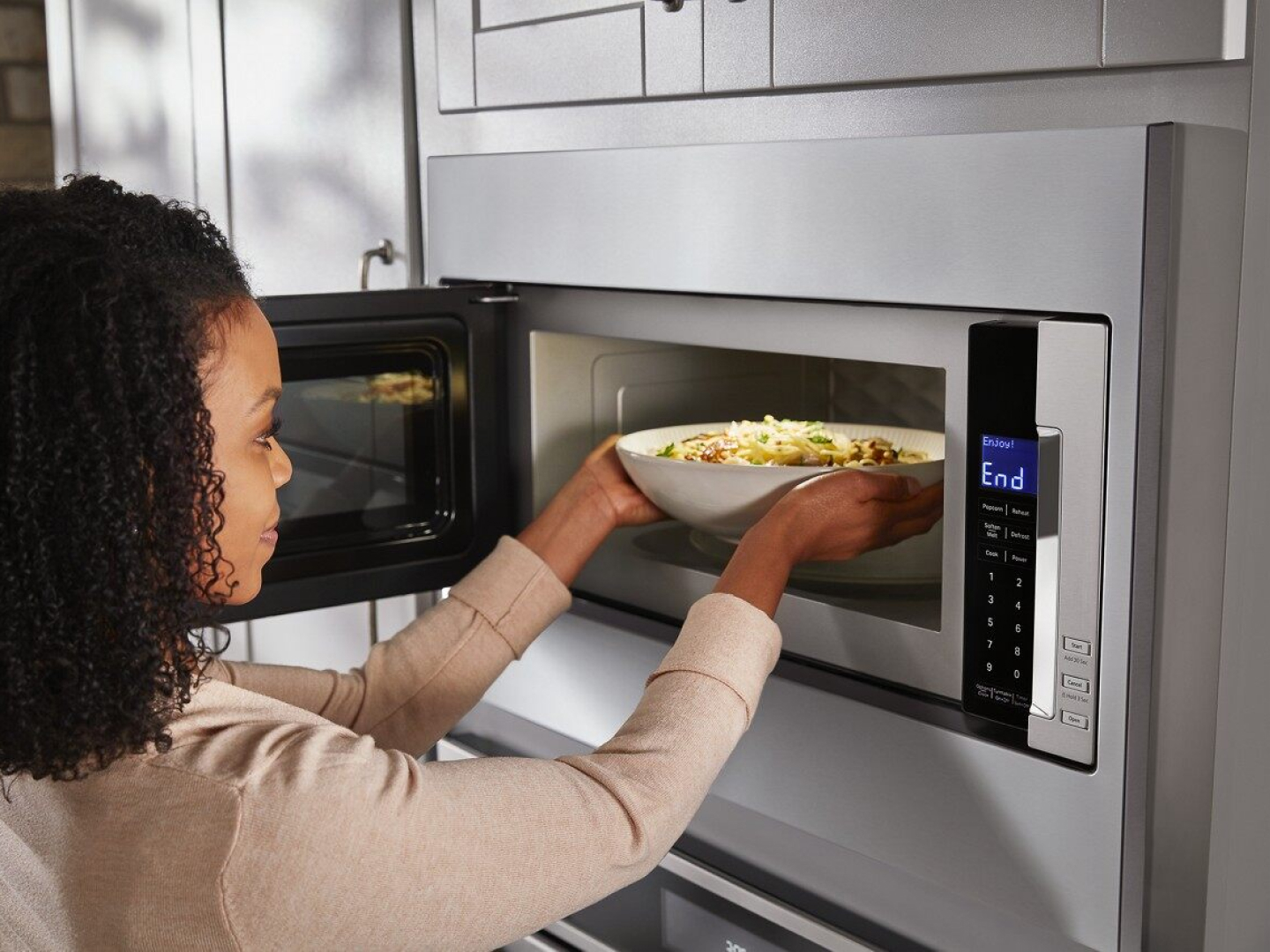 Removing a reheated meal 