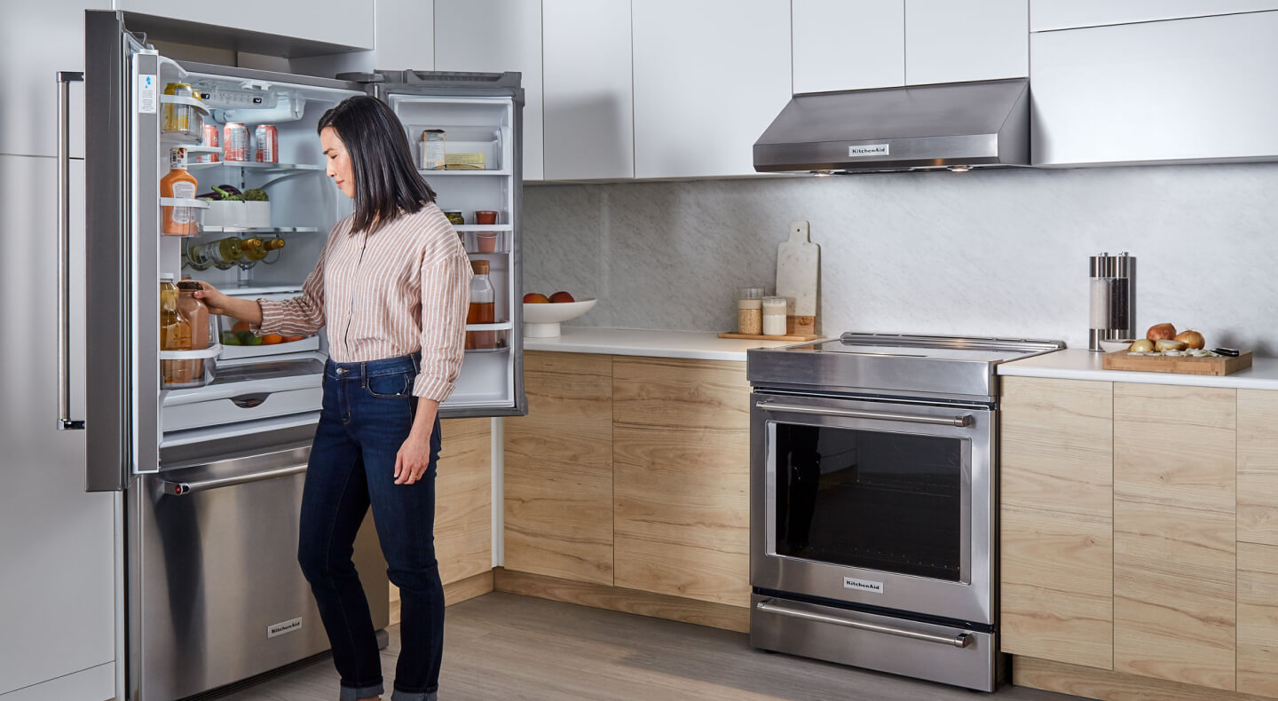 Person looking in KitchenAid® french door refrigerator