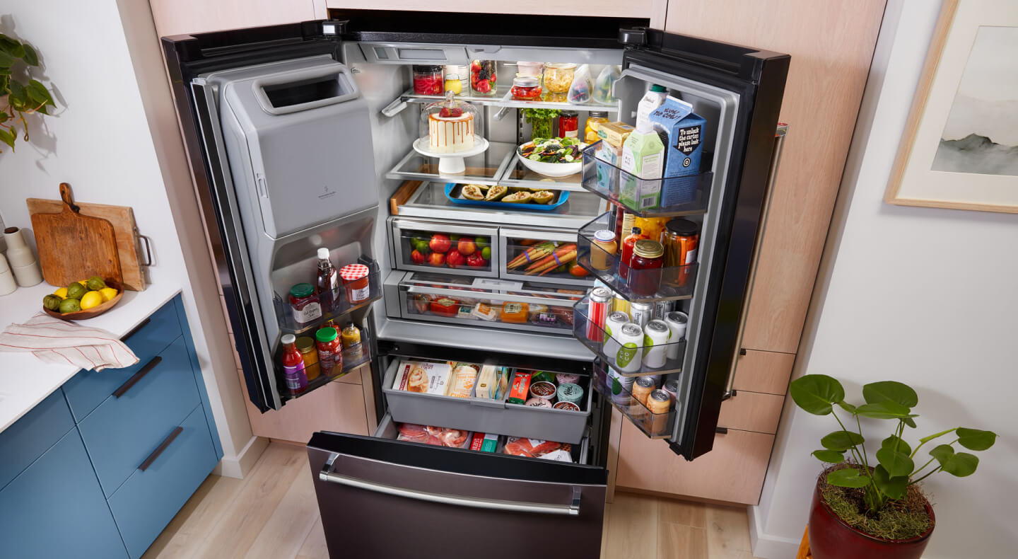 View from above bottom freezer refrigerator with all doors open