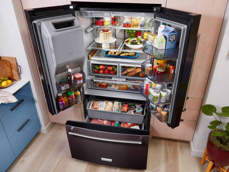 View from above bottom freezer refrigerator with all doors open