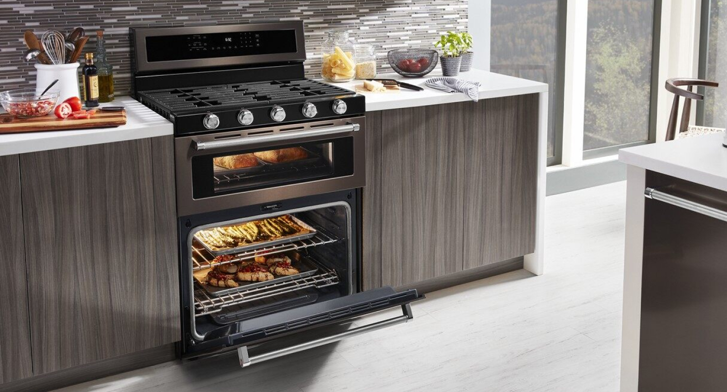 Various dishes cooking in a gas oven range