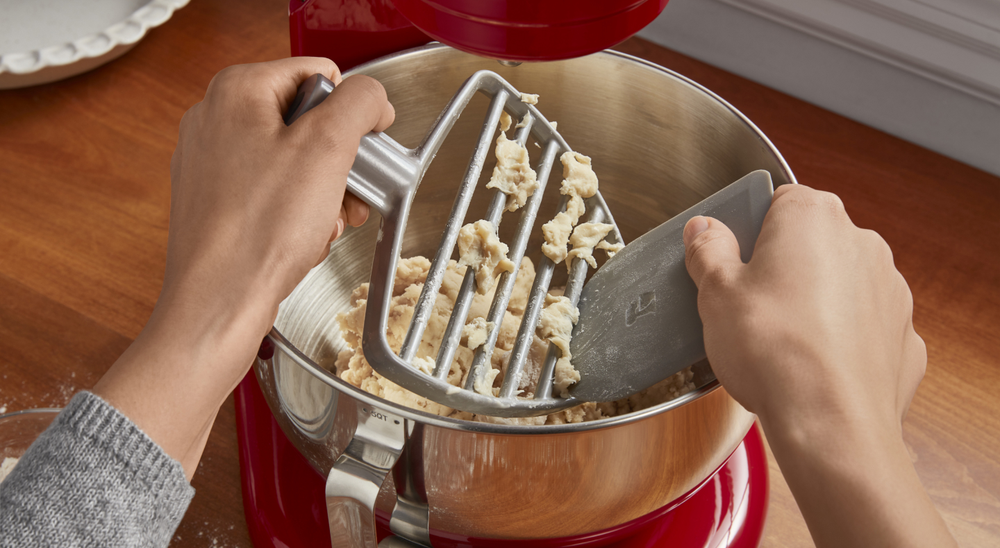 Dough being removed from a pastry beater