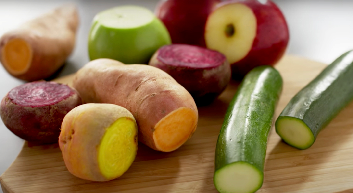 A variety of vegetables on a cutting board