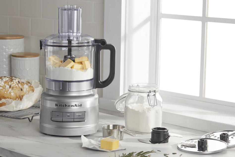 Food processor cutting butter into flour