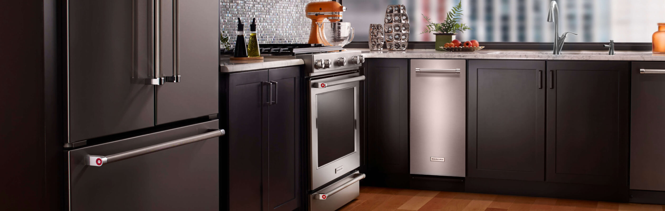 The interior of a kitchen with a KitchenAid® trash compactor