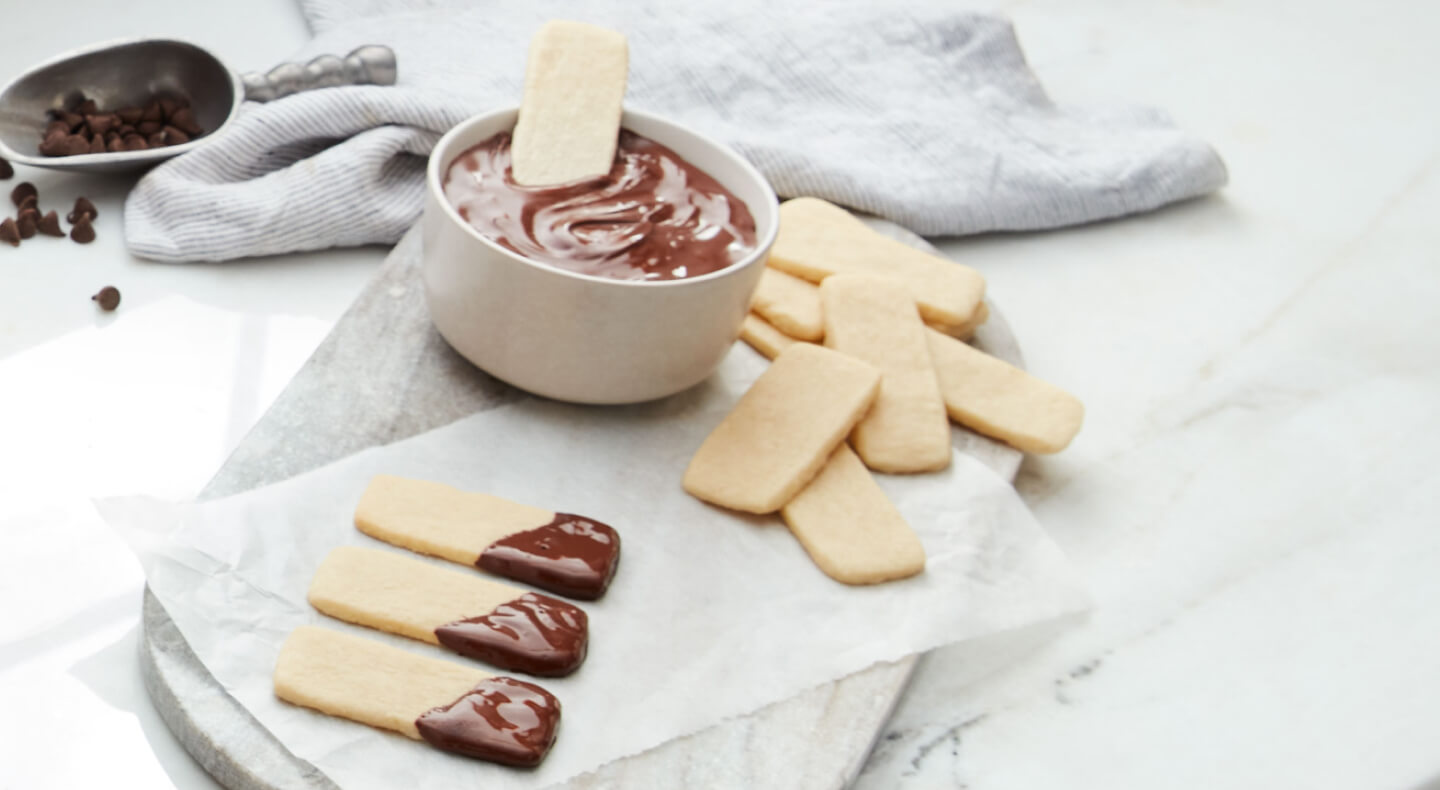 Baked sugar sticks dipped in ganache